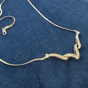 Sterling silver round and baguette diamond necklace